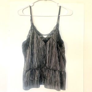 Adorable shiny top! Made by Elodie. Size: Large